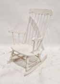 A 20th century white painted stickback rocking chair, measuring approx 101 cm high