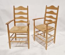 Pair of Arts and Crafts chairs by Paul Spriggs, ash frames with shaped ladderback and rush seat,