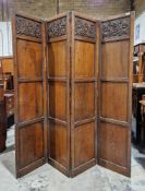 19th century oak four-fold screen, each section made up of four framed panels, the tops with