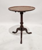 Victorian mahogany tilt-top occasional table of circular form, raised on tripod cabriole legs,
