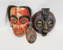 Three painted and beaded African wall masks (3)