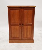 A contemporary hardwood two door vinyl and CD cabinet, the bifold door opening to reveal fitted