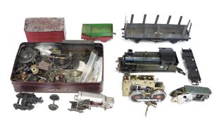 Two boxes of train building parts to include part-built locomotive, wheels, gears, etc