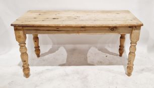 Pine kitchen table, rounded rectangular top with thumb mould edge, on turned supports, 76cm high,