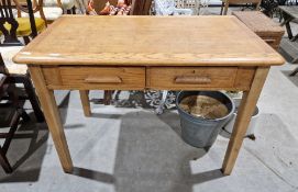 A mid century oak desk by Abbess no 698 having two short drawers on the front raised on squared legs