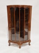 Mid-century walnut veneer floor-standing corner display cabinet, the glazed door opening to reveal