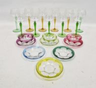 LOT WITHDRAWN Eleven 20th century coloured hock glasses, with coloured baluster stems in green and