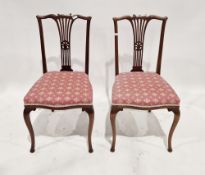 Two stained wood dining chairs with scroll top rail, pierced vase splat, on cabriole supports (2)