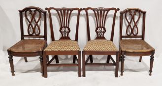 A pair of late 19th/early 20th century cane-seated dining chairs, each with shaped splats, raised
