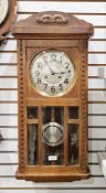 Early to mid 20th century oak-cased wall clock, circular silvered dial with brass bezel and arabic n