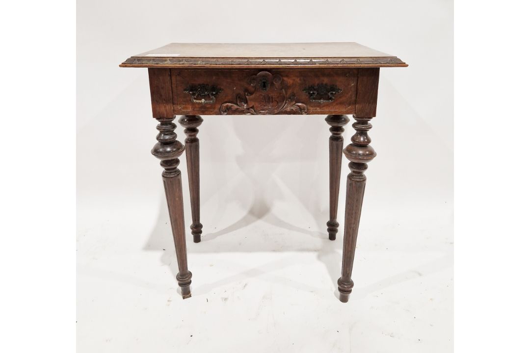 An early oak hall table of rectangular form, having a single drawer to the front with carved foliate