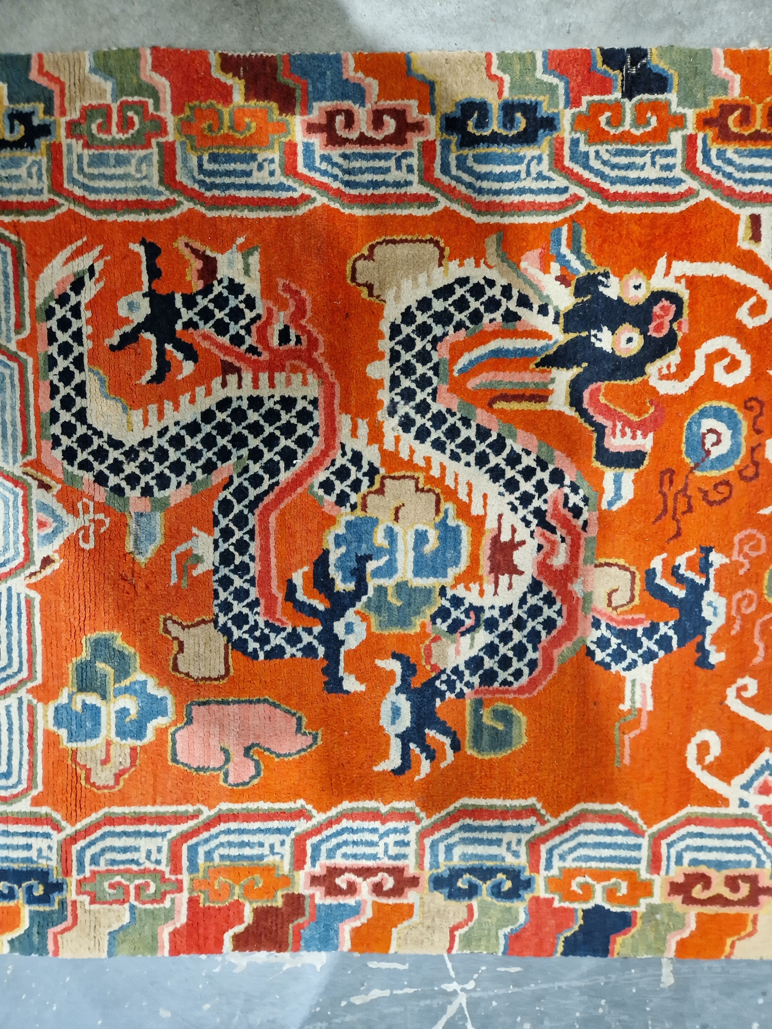 Pair of Chinese style rugs, possibly Tibetan, the central panel with two dragons chasing flaming - Image 33 of 88