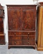 Victorian flamed mahogany linen press, the two door cupboard opening to reveal four trays, the