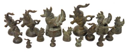 Collection of assorted Burmese bronze 'opium' weights and models of animals including elephants,
