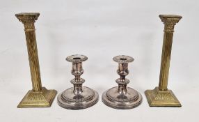 Pair of silver plated candlesticks with gadrooned borders on circular base, and another pair of