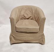 A modern upholstered club chair raised on turned wooden legs, measuring approx 76 cm high