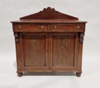 Mahogany chiffonier comprising two short drawers over a two-door cupboard, the latter opening to