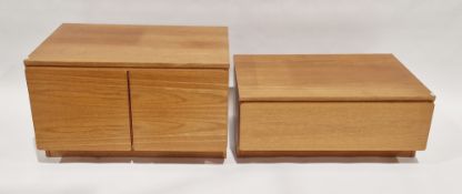 Two 20th century oak storage units, one having a single long drawer, the other being a two-door