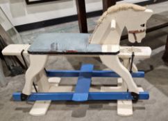 20th century white painted rocking horse with leather upholstered seat, white and blue painted, 92cm