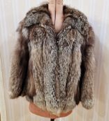 Vintage black/grey fox fur jacket, no label, the inner seam lined with leather, and a small rip of