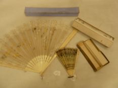 Painted and lace trimmed silk chiffon fan with carved bone guards in original blue box, a fan box