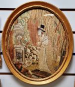 A late 18th century embroidered scene showing a woman mourning at a tomb, her face is painted as