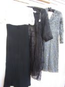 A 1970s maxi dress, empire line, navy blue skirt with lace bodice, puff sleeves and mandarin collar,