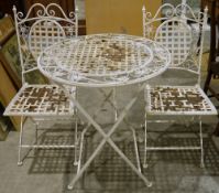 Metal cream painted garden table, circular, decorated with flowers and butterflies, two matching