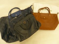 Longchamps brown leather tote bag, a Longchamps blue calf leather holdall, and a Longchamps