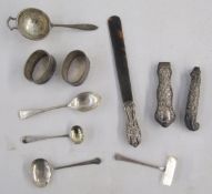 Silver handled tortoiseshell letter opener, silver child's spoon and push, silver tea strainer, pair