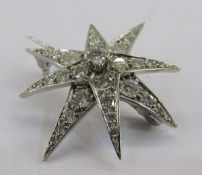 18ct white gold and diamond star brooch, eight-pointed, marker JHL, 3cm diameter, London 1977