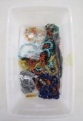 Large quantity of necklaces comprising turquoise, coral, amber coloured stones, lapis lazuli and