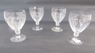 Four cut glass rummers, each lappet cut bowl above knopped stem, on spreading foot, 16cm high (4)