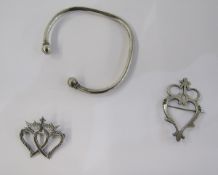 A silver bangle, silver bracelets, a Scottish silver openwork brooch in the form of entwined