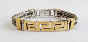 Silver coloured metal bracelet of double ropetwist form centred by gold-plated Greek key panel, 45g,
