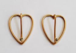 Gold-coloured metal and diamond set money clips, heart-shaped, openwork and each set single small