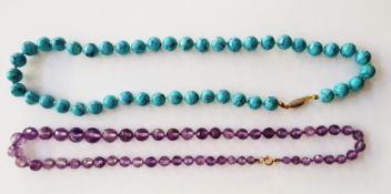 Polished turquoise bead necklace, single-strand and a graduated faceted amethyst-coloured bead