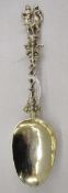 Three Victorian silver gilt embossed and pierced spoons, each having ornate finial, hallmarked