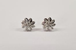 Pair of Gemporia platinum and diamond earrings, each flowerhead set with multiple diamonds