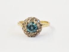 9ct gold zircon and diamond ring, set single blue stone to centre and surround of tiny diamonds size