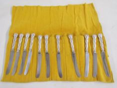 Set of twelve 20th century sterling silver knives, each sterling rocaille cast handle engraved