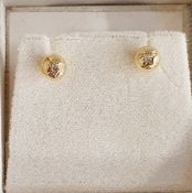 Pair 18ct gold and diamond stud earrings, each spherical and set single diamond