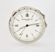 Contemporary Baume & Mercier Geneve stainless steel cased travel clock, the circular case with easel
