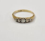 18ct gold and five-stone diamond ring, set graduated stones on scroll engraved shoulders, size P