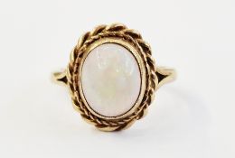 9ct gold and opal single stone ring, set centre opal stone within ropetwist surround size M, 4.25g