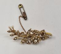 Victorian gold-coloured metal and seedpearl floral spray brooch
