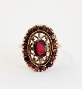 19th century 9ct gold and garnet ring, set centre oval facet-cut garnet in openwork setting and