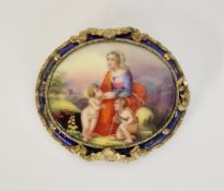 Antique gilt metal and porcelain brooch, having large oval porcelain plaque depicting the Virgin