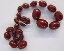 String of red graduated amber oval beads (string broken)  Condition Report The weight is 91g.