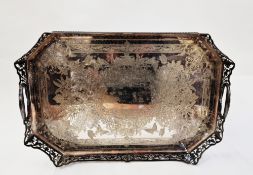 A large silver plated and engraved tray with a pierced gallery, elaborate engraved floral decoration